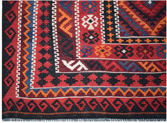 A handmade Afghan Maimana kilim featuring intricate geometric patterns in red, blue, and orange.