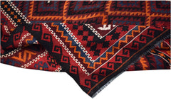 A handwoven Afghan Maimana kilim rug featuring geometric patterns in red, black, orange, and blue.