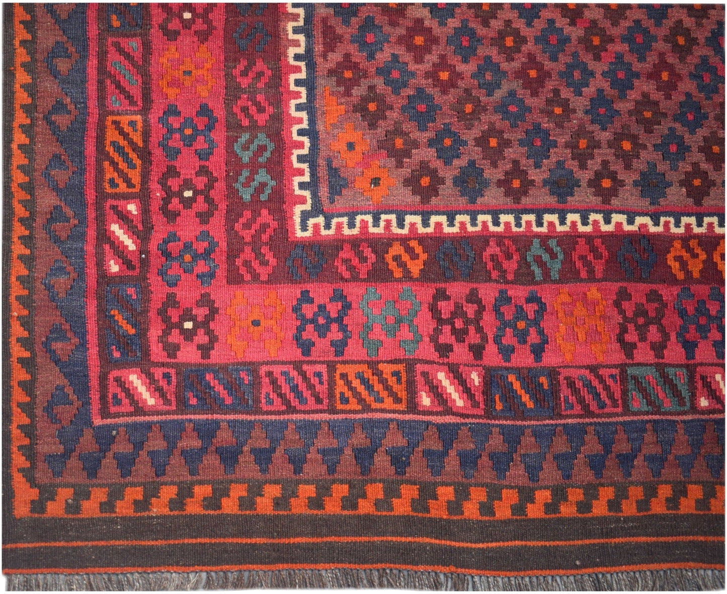 Handmade Afghan Maimana kilim rug featuring a geometric pattern in rich red, blue, and orange tones.