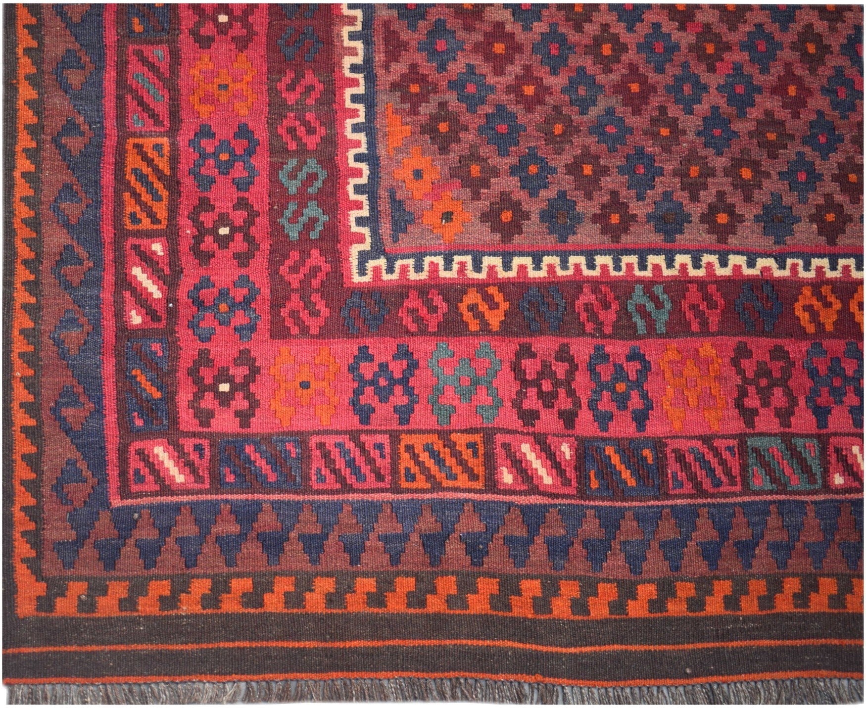 Handmade Afghan Maimana kilim rug featuring a geometric pattern in rich red, blue, and orange tones.
