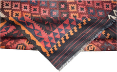 Handwoven Afghan Maimana kilim featuring a geometric pattern in red, orange, and dark blue wool.