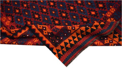 Handwoven Afghan Maimana kilim featuring a geometric pattern in red, blue, and orange wool.