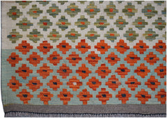 Handwoven Afghan Maimana kilim rug featuring a geometric pattern in orange, green, and blue.