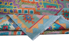 A handwoven Afghan Maimana kilim rug featuring vibrant geometric patterns in wool.