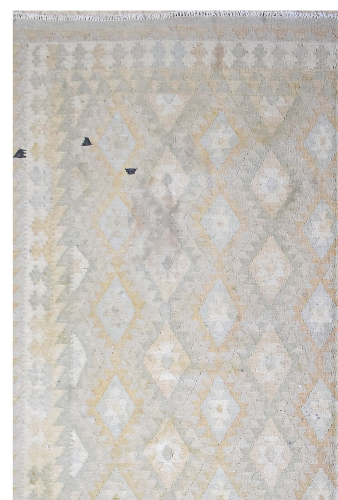 A handmade Afghan Maimana kilim rug featuring a repeating geometric diamond pattern in neutral tones.