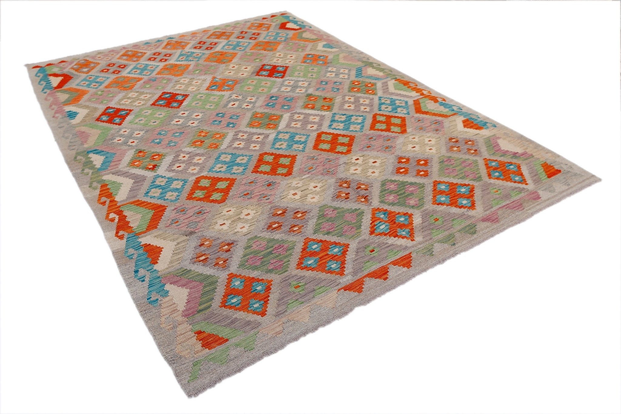 A rectangular Afghan Maimana kilim rug featuring a colorful geometric pattern on a grey background.