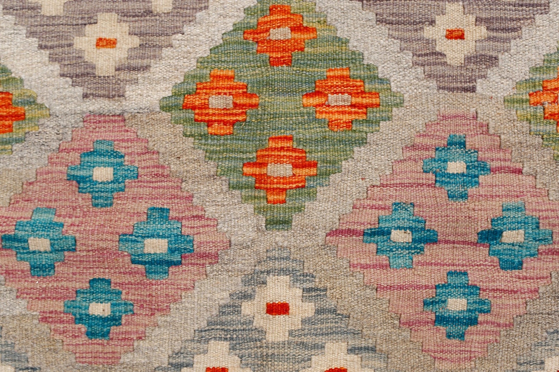 Handwoven Afghan Maimana Kilim featuring a geometric pattern of colorful diamonds on a neutral base.