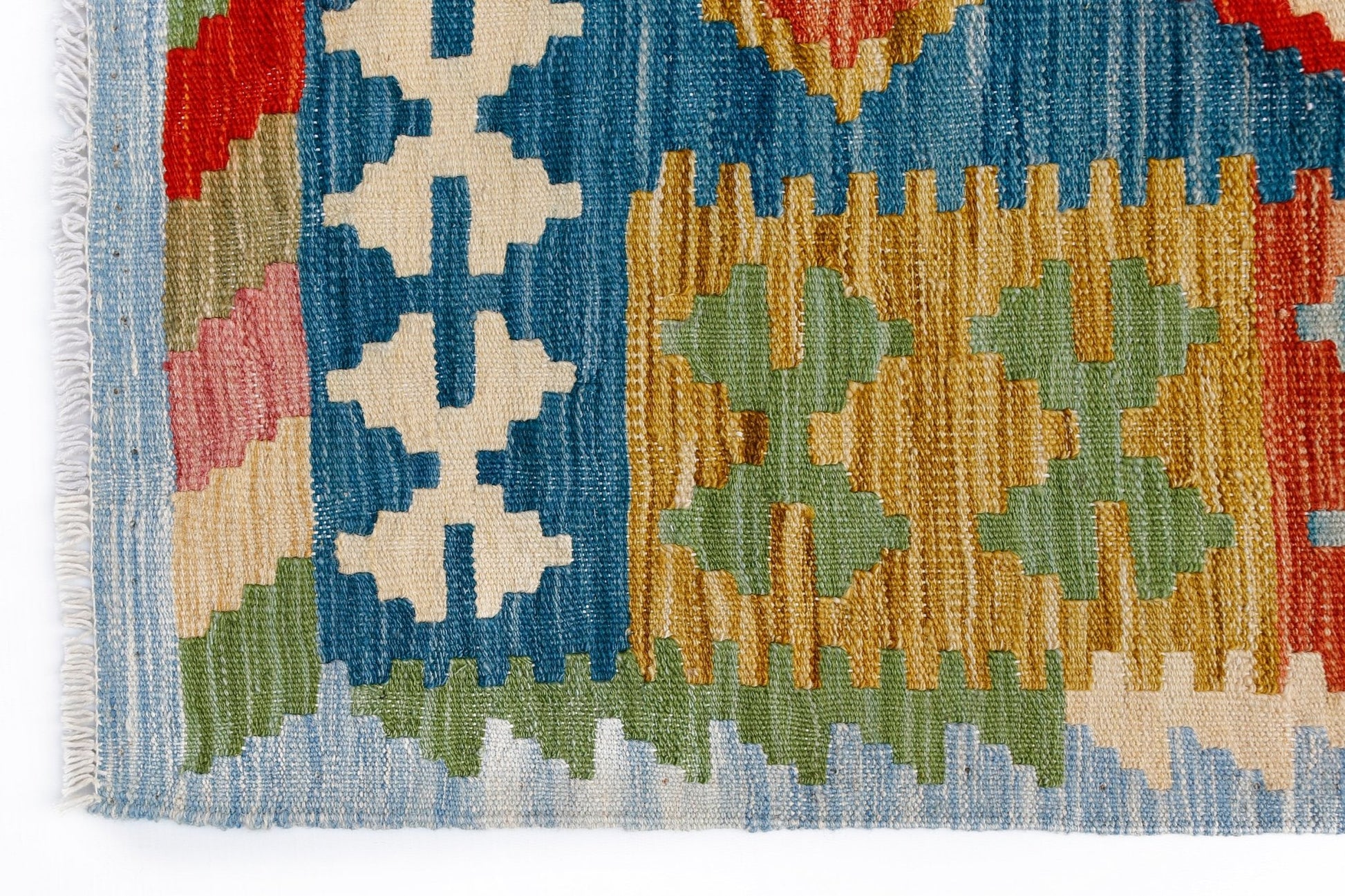 A handmade Afghan Maimana kilim featuring a geometric pattern in blue, yellow, green, and red.