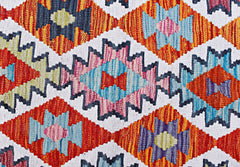 Handwoven Afghan Maimana kilim featuring a vibrant geometric diamond pattern in wool.