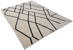 Handwoven Afghan Maimana kilim rug featuring a geometric black pattern on a cream wool background.