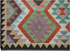 Handwoven Afghan Maimana kilim rug featuring a colorful geometric diamond pattern in wool.