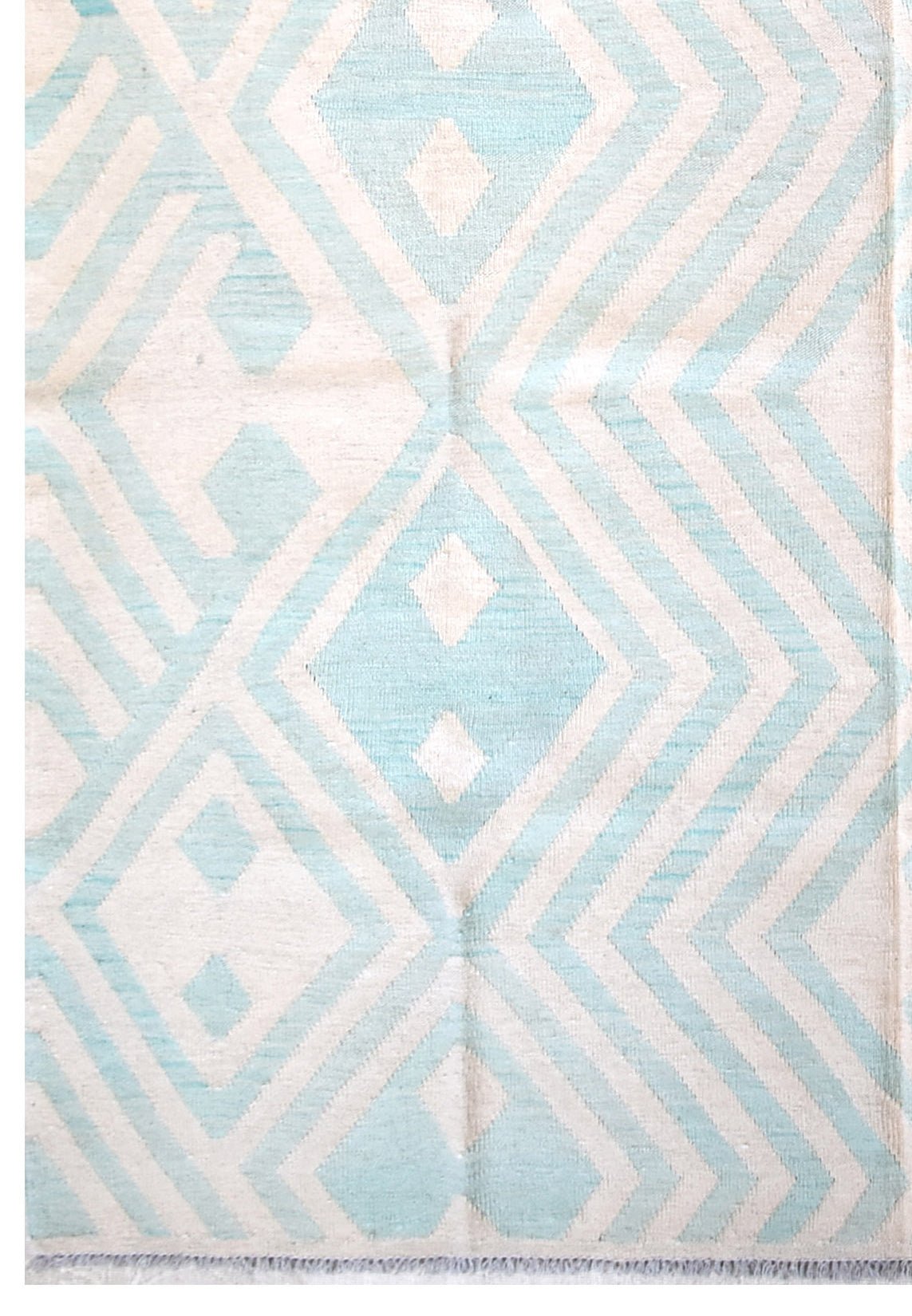 Handmade Afghan Maimana kilim rug featuring a geometric pattern in light blue and cream wool.
