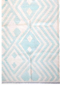 Handmade Afghan Maimana kilim rug featuring a geometric pattern in light blue and cream wool.