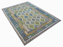 Handwoven Afghan Maimana kilim rug featuring a geometric diamond pattern in blue, green, and tan.