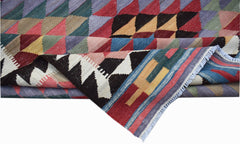 Handwoven Afghan Maimana kilim featuring a colorful geometric pattern and flatweave wool texture.