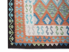 Handwoven Afghan Maimana kilim featuring a geometric pattern in orange, blue, green, and grey.