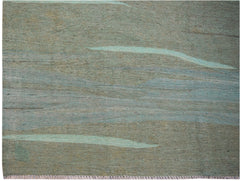 Handwoven Afghan Maimana kilim featuring a flat-weave texture with abstract blue and grey tones.