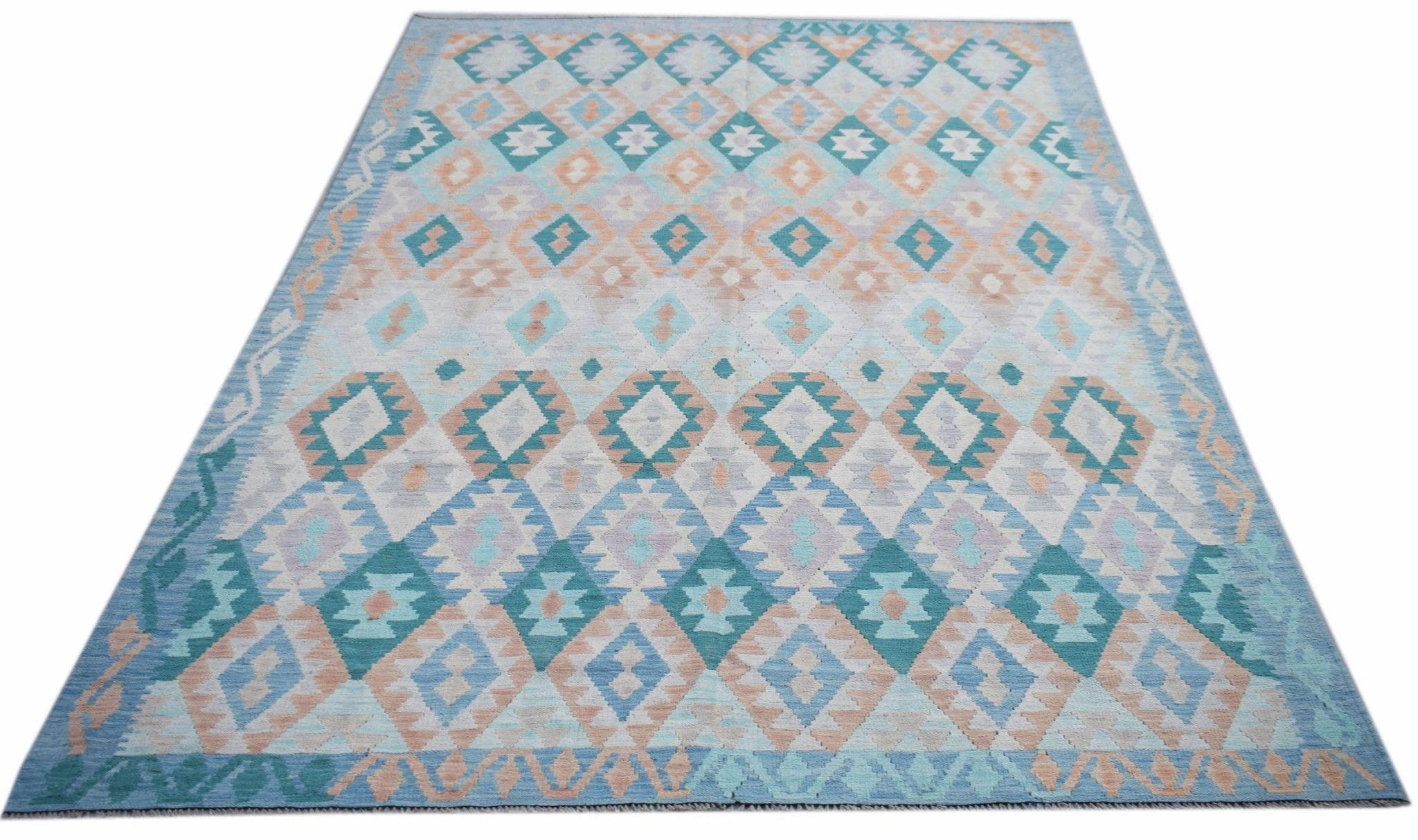 Handwoven Afghan Maimana kilim rug featuring a geometric diamond pattern in blue and peach tones.