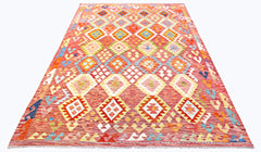 Handwoven Afghan Maimana kilim rug featuring a vibrant red field with geometric diamond patterns.