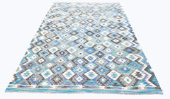 Handwoven Afghan Maimana kilim rug featuring a geometric diamond pattern in shades of blue and grey.