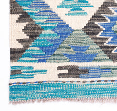 Handwoven Afghan Maimana kilim featuring a geometric pattern in shades of blue, grey, and cream.