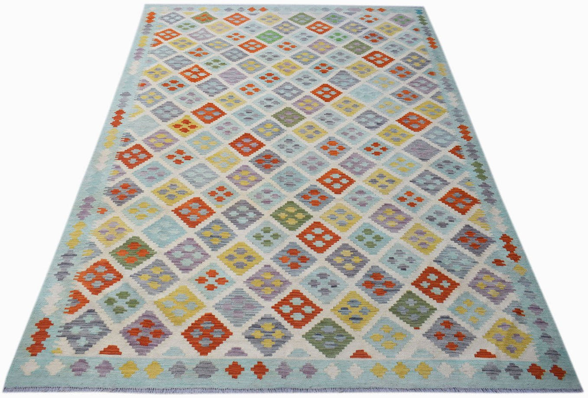 Handwoven Afghan Maimana kilim rug featuring a colorful geometric diamond pattern on a light base.