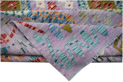 Handwoven Afghan Maimana kilim rug featuring a geometric pattern in purple, blue, and orange tones.