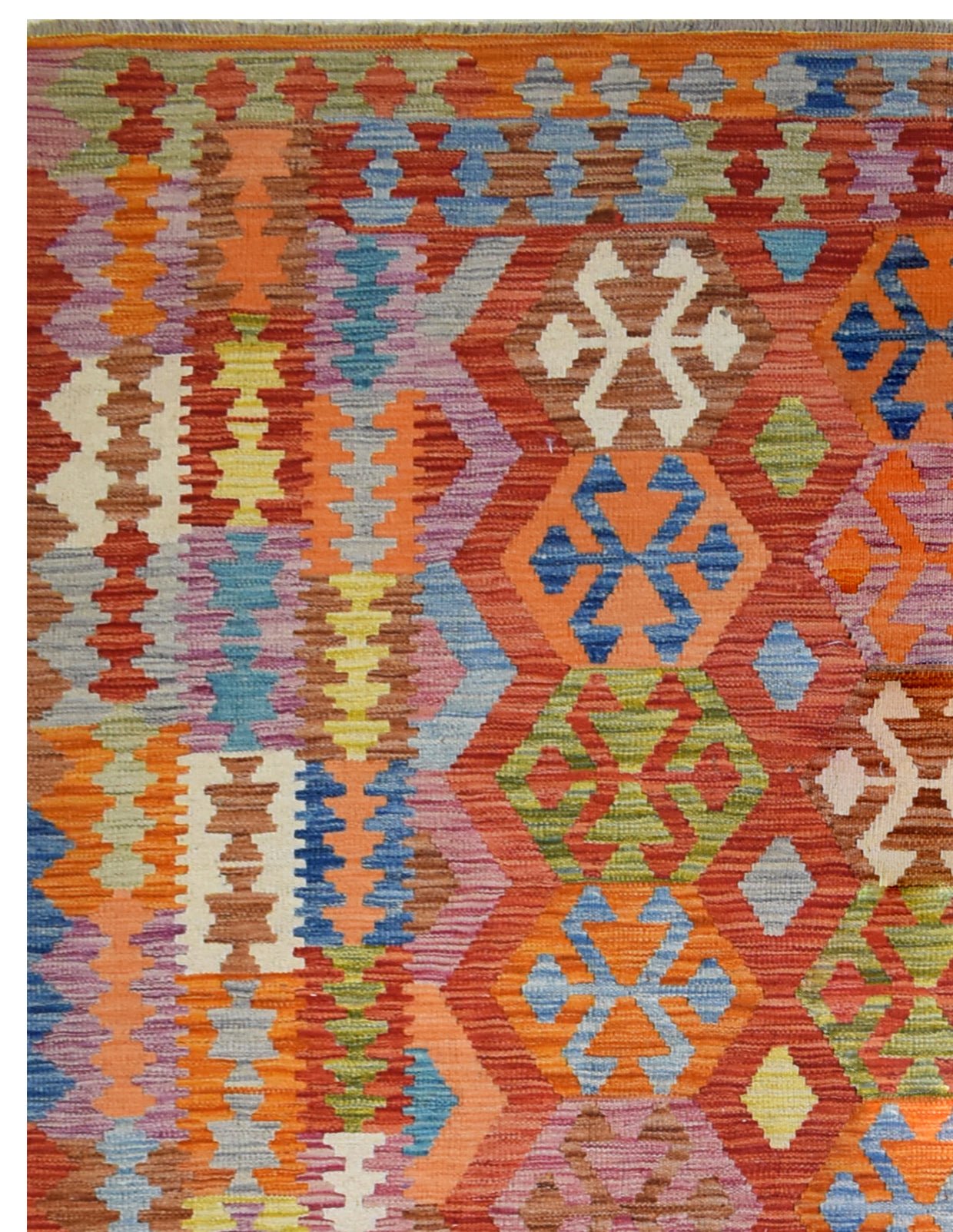 A handmade Afghan Maimana kilim rug featuring vibrant geometric patterns in a rich color palette.