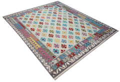 Handwoven Afghan Maimana kilim rug featuring a colorful geometric diamond pattern on a light base.