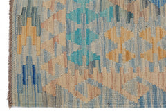 Handwoven Afghan Maimana kilim rug featuring a geometric pattern in blue, tan, and peach tones.