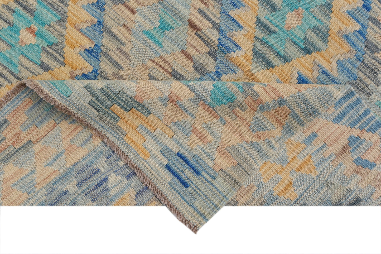 A handmade Afghan Maimana kilim rug featuring a geometric pattern in blue, beige, and tan tones.