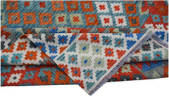 Handwoven Afghan Maimana kilim rug featuring a colorful geometric pattern on a flat wool weave.