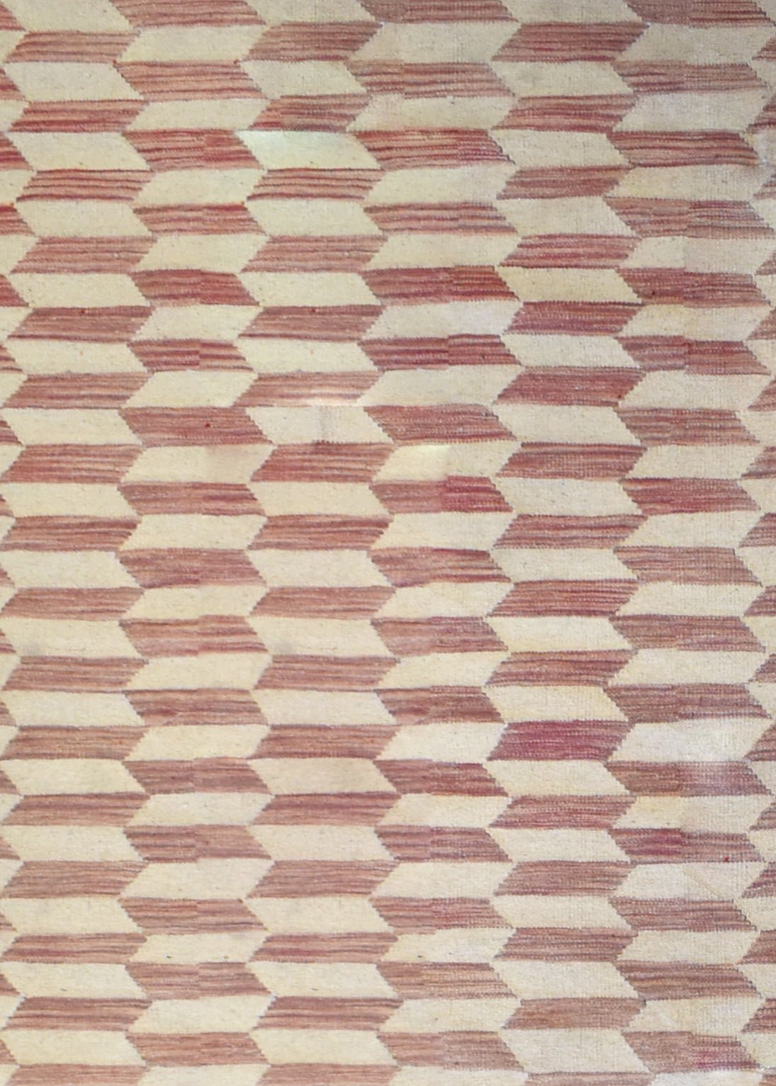 Handmade Afghan Maimana kilim rug featuring a repeating geometric pattern in red and cream wool.