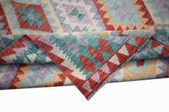 Handwoven Afghan Maimana kilim rug featuring a colorful geometric diamond pattern.