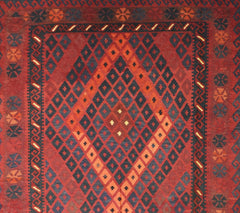 Handmade Afghan Maimana kilim rug featuring a geometric diamond pattern in red and dark blue.