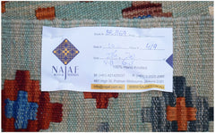 A handwoven Afghan Maimana Kilim featuring a geometric pattern in blue, orange, and grey tones.