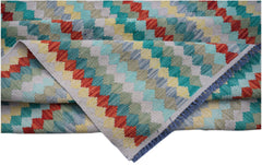 Handwoven Afghan Maimana kilim rug featuring a colorful geometric pattern in wool.