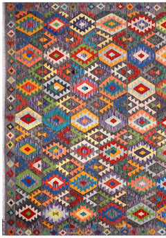 Handmade Afghan Maimana kilim rug featuring a vibrant geometric diamond pattern on a grey background.