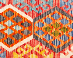 Handwoven Afghan Maimana Kilim featuring a vibrant geometric pattern in wool.