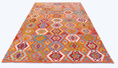 Handwoven Afghan Maimana kilim rug featuring a vibrant geometric pattern in wool.