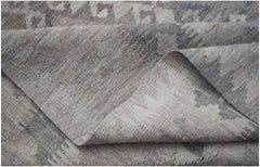 A handwoven Afghan Maiamana kilim rug featuring a flatweave texture and neutral geometric patterns.