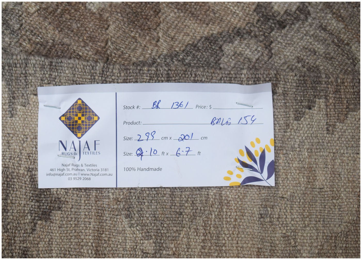 An Afghan Maimana Kilim rug featuring a neutral-toned geometric pattern and flatweave texture.