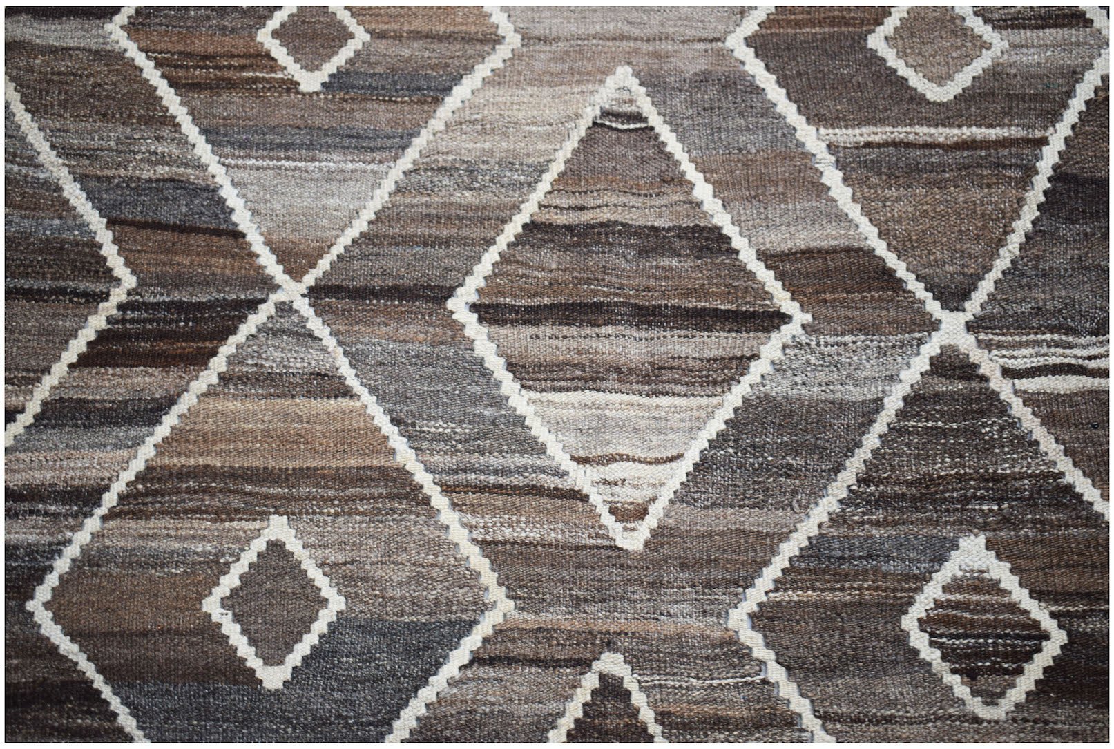 Afghan Maimana Kilim with a diamond pattern in brown and white.