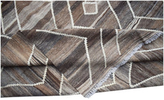 Handwoven Afghan Maimana kilim featuring a geometric pattern in shades of brown and cream.