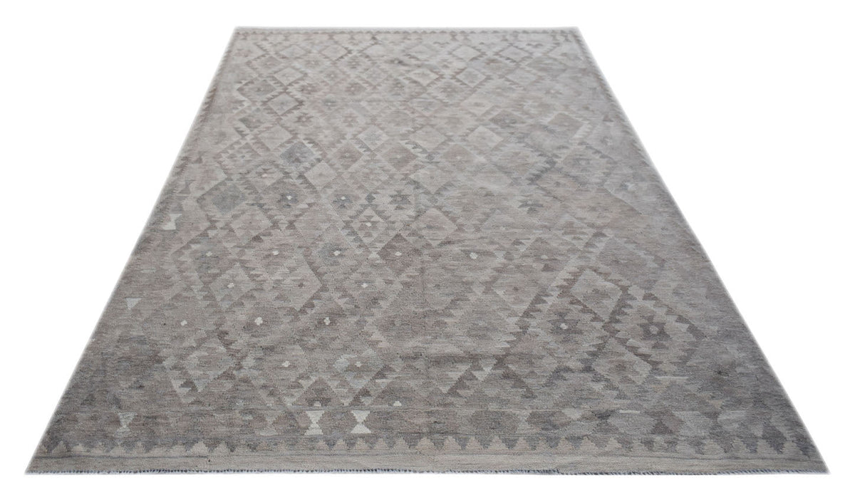 Handwoven Afghan Maimana kilim rug featuring a neutral geometric pattern in undyed natural wool.
