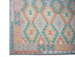 Handwoven Afghan Maimana kilim rug featuring a geometric diamond pattern in pastel colors.