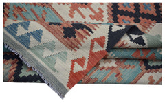 A handmade Afghan Maimana kilim rug featuring a geometric pattern in blue, red, and cream wool.