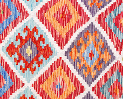 Handwoven Afghan Maimana kilim featuring a vibrant geometric diamond pattern in wool.