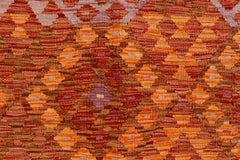 Handwoven Afghan Maimana kilim featuring a repeating geometric diamond pattern in warm earth tones.