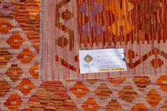 An Afghan Maimana kilim featuring a geometric pattern in shades of orange, red, and purple.